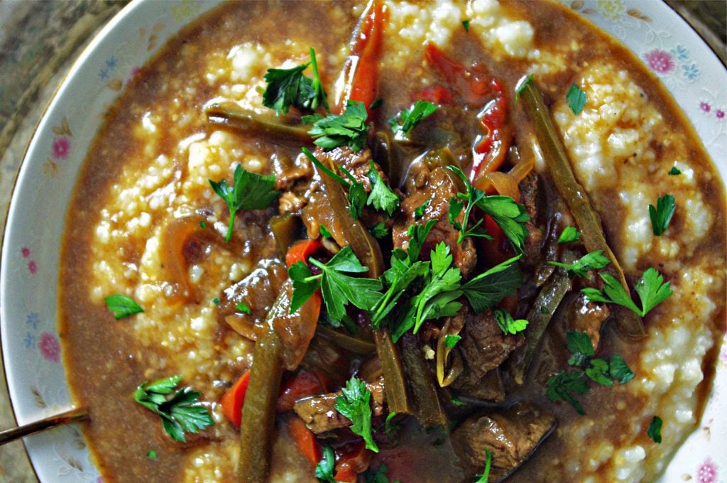 Pepper Steak Over White Cheddar Grits